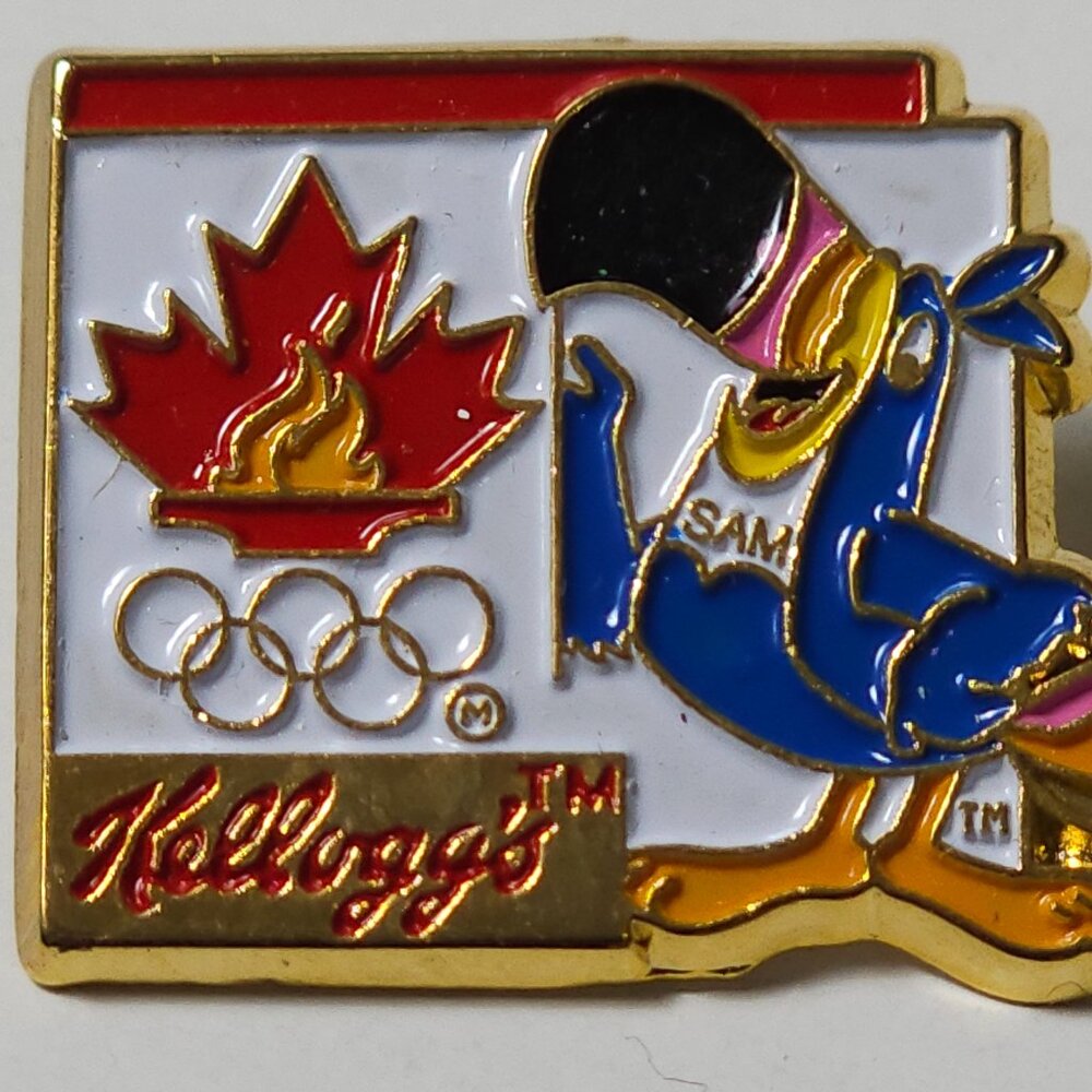 KELLOGG'S TOUCAN SAM OLYMPIC SPONSOR METAL LAPEL PIN WEAR CEREAL AD CARTOON